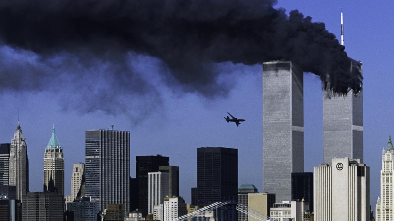 United Airlines Flight 175 approaches the World Trade Center above the Manhattan skyline, crashing into its south tower. Picture: Robert Clark