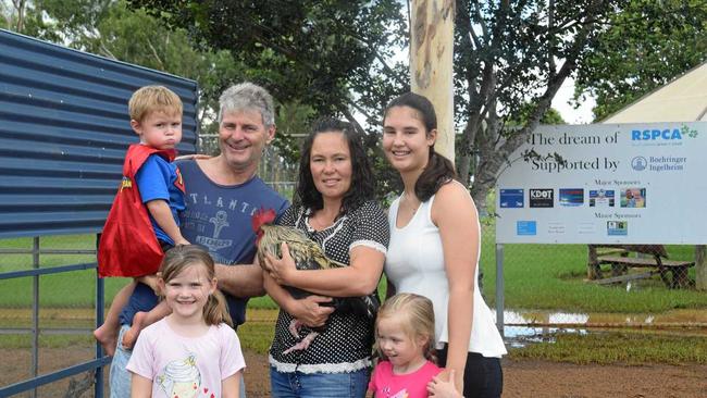 COMING HOME TO ROOST: Ian Birchley, Regina Birchley, Courtney Burrows, Laylah Dyer, Brydee Pszkit, and Axle Dyer at Kingaroy RSPCA with their new rooster Hei Hei. Picture: Madeline Grace