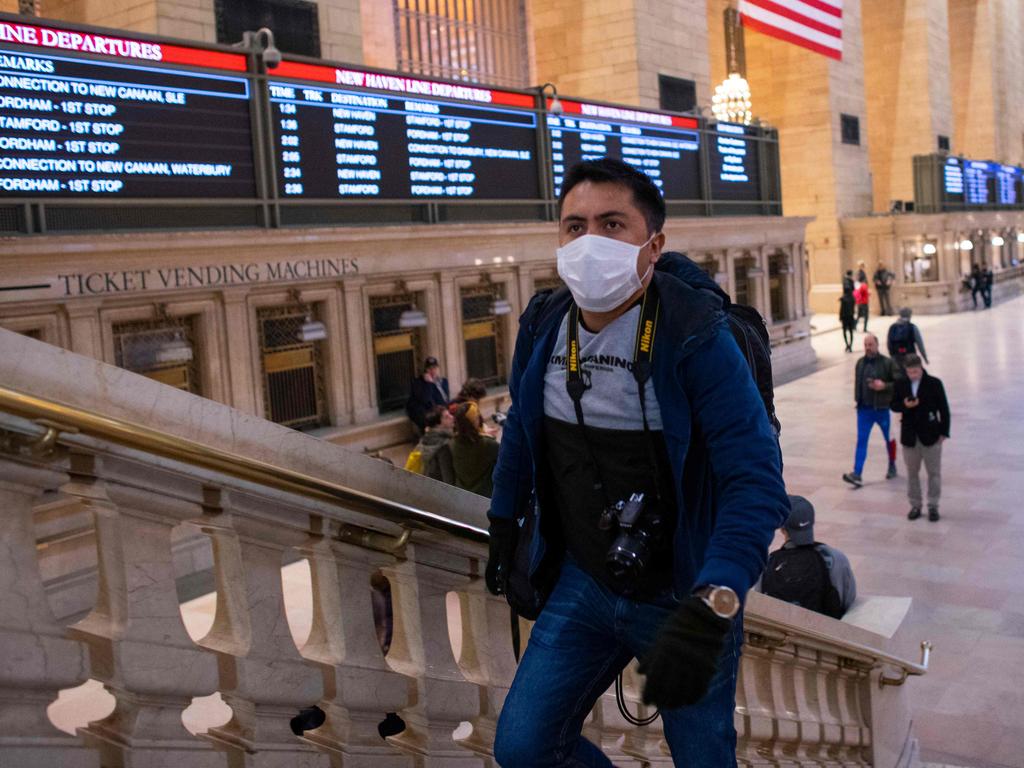 A man wears a face mask as he walks inside Grand Central Station this week. Picture: Kena Betancur / AFP