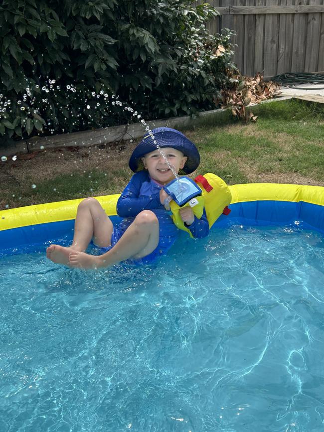 Torin Seamons enjoys some backyard summer fun on his new inflatable water park. Picture: Kathryn Seamons, Beveridge.