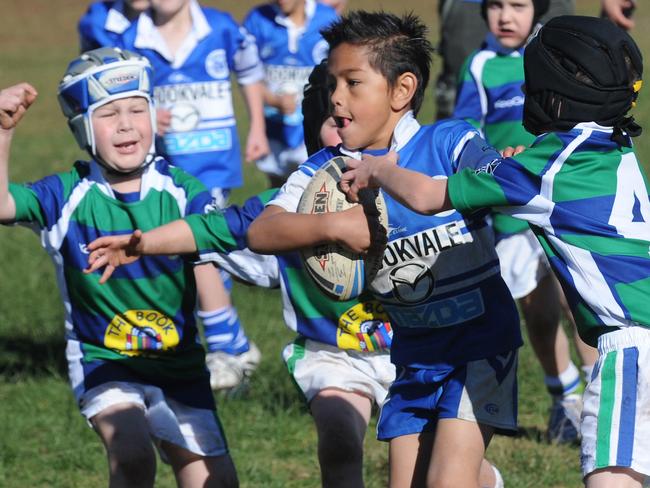 Dee Why, with the ball, take on Cromer in this junior rugby league match. League officials are still waiting on advice from NSWRL about when the season will officially finish. Picture: Manly Daily