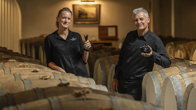 Cellar door assistant managers, Louise Shepley and David Letch with a sample and bottle of the celebrated Seppeltsfield 1922 100-year old tawny port. Picture: Roy VanDerVegt