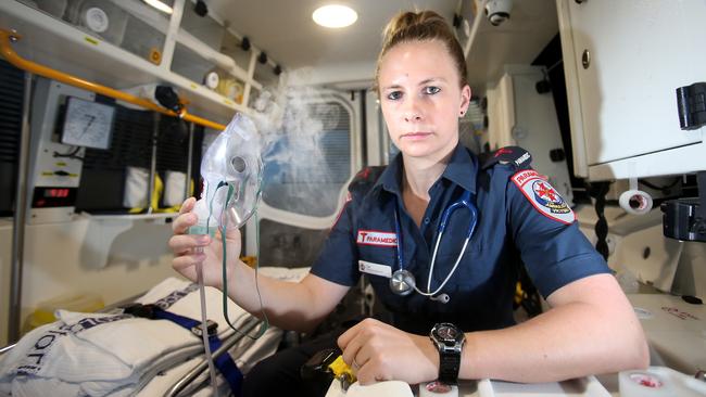 Ambulance Paramedic Cat Cristofaro responded to a string of thunderstorm asthma incidents during a non-stop 15.5 hour shift on Monday. It included a 12yo girl who was on the verge of a cardiac arrest, whose family were shouting "she's dead" when paramedics arrive. Cat  at  Hillside AV station  , Picture Yuri Kouzmin