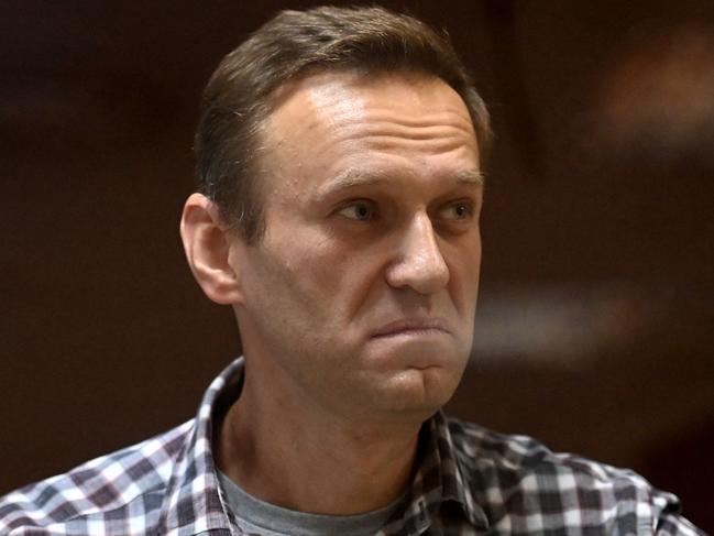 Russian opposition leader Alexei Navalny stands inside a glass cell during a court hearing at the Babushkinsky district court in Moscow in 2021. Picture: AFP