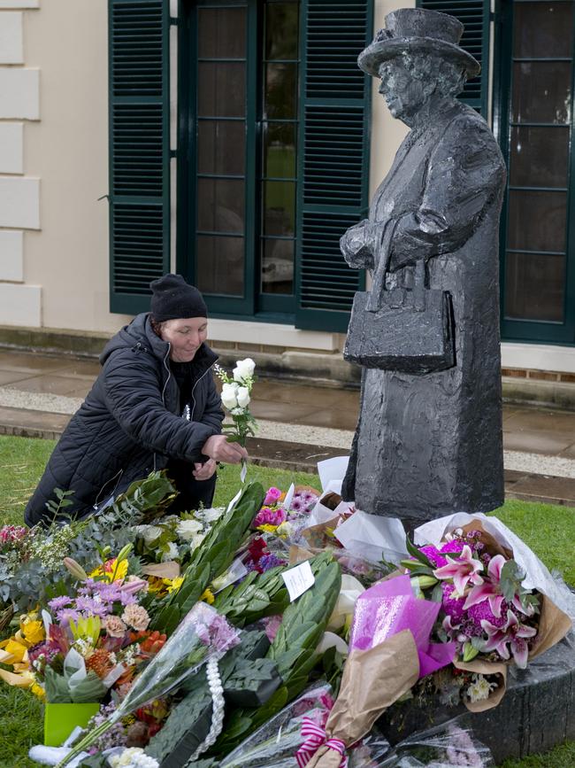 Floral tributes at the statue of Queen Elizabeth at Government House in Adelaide. Picture: Naomi Jellicoe