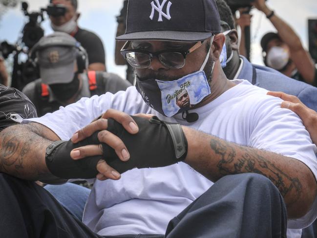 Terrence Floyd sits silently at the spot at the intersection of 38th Street and Chicago Avenue, Minneapolis. Picture: AP