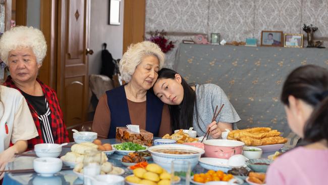 Awkwafina (centre) stars in the arresting and uplifting the Farewell. Supplied: Roadshow Films.