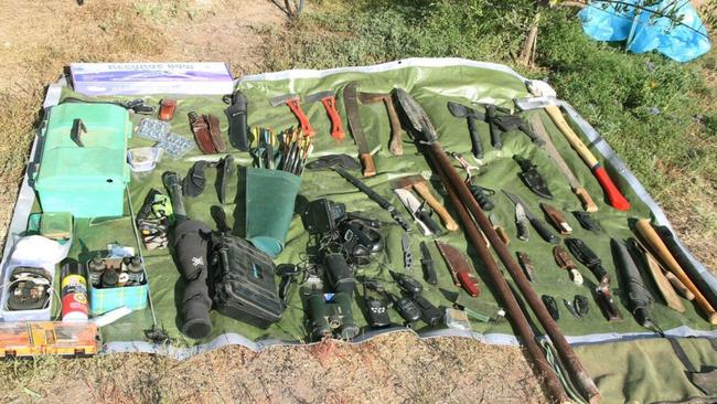 The cache of firearms, weapons and military equipment found on the Trains’ Wieambilla property.