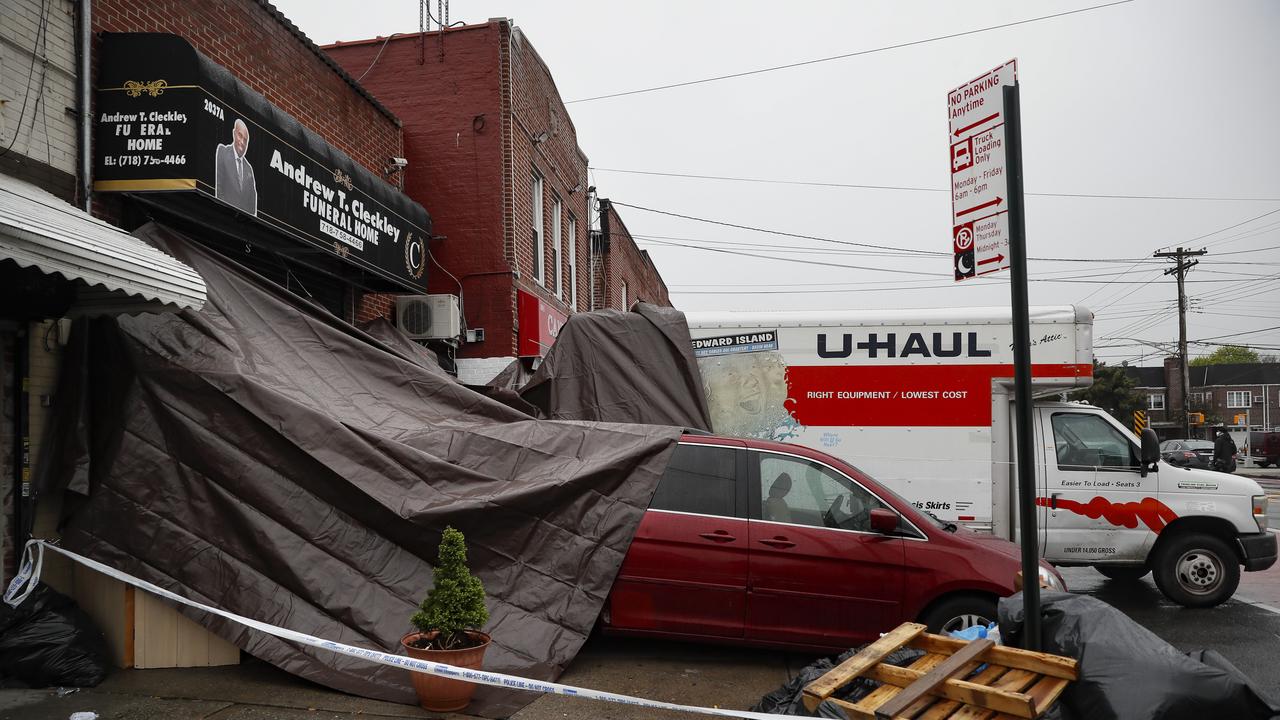 Police were called to the funeral home Wednesday after it resorted to storing dozens of bodies on ice in rented trucks. Picture: AP / John Minchillo.