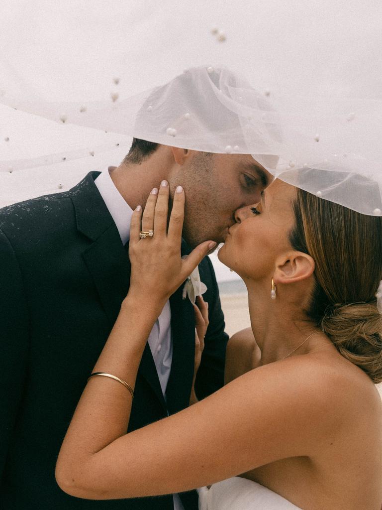 Port Adelaide star Jeremy Finlayson and his wife Kellie Finlayson married Tennyson Beach. Picture: bambiphoto & Danielle Symes