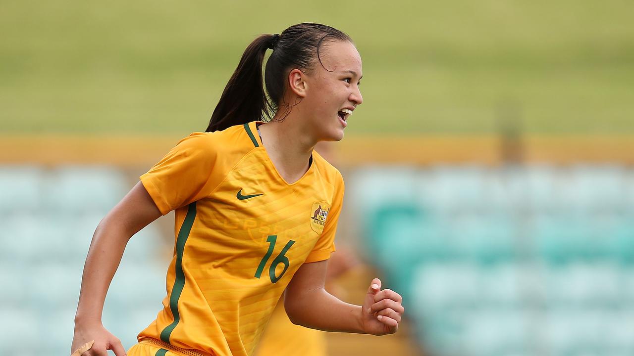Amy Sayer of Australia celebrates scoring a goal during the International match between the Young Matildas and Thailand.
