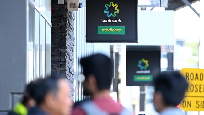 People queue to enter Centrelink. There are 1.7 million Australians now on JobSeeker unemployment benefits. Picture: Quinn Rooney/Getty Images