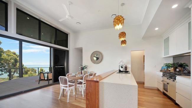 The property boasts an open living area that flows out onto an entertaining balcony with ocean views and gourmet kitchen with a butler’s pantry. Picture: Contributed