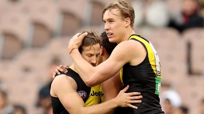 Kane Lambert is congratulated by teammates after another Tigers goal. Pic: AAP