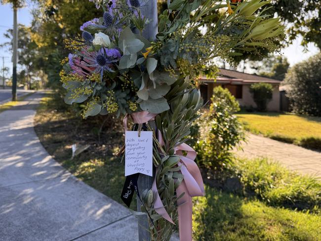 A floral tribute left where a young mum was allegedly hit and killed by a Toyota Prado.