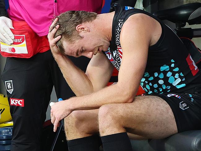 ADELAIDE, AUSTRALIA - MAY 17: Jason Horne-Francis of the Power taken from the ground with a suspected hamstring injury during the 2025 AFL Round 10 match between Yartapuulti (Port Adelaide Power) and the Geelong Cats at Adelaide Oval on May 17, 2025 in Adelaide, Australia. (Photo by Sarah Reed/AFL Photos via Getty Images)