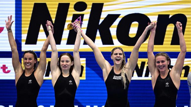 Australia's Brianna Throssell, Mollie O'Callaghan, Shayna Jack and Ariarne Titmus celebrate their win in the final of the women's 4x200m freestyle relay. Picture: Yuichi YAMAZAKI / AFP