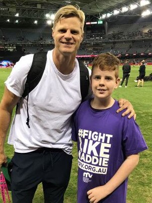 Blake Dridan with Nick Riewoldt. Reiwoldt's sister, Maddie, died aged 26 of bone marrow failure syndrome. Blake, who also suffered from BMFS, is the face of his family's charity to raise money for medical research. Picture: Supplied