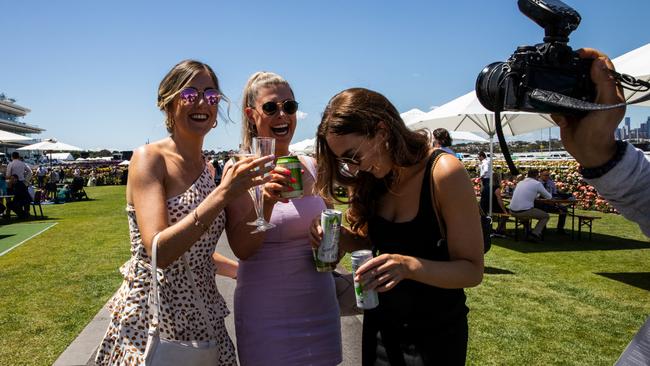 Spectators pose for a photo after race 4. Picture: Diego Fedele/Getty Images