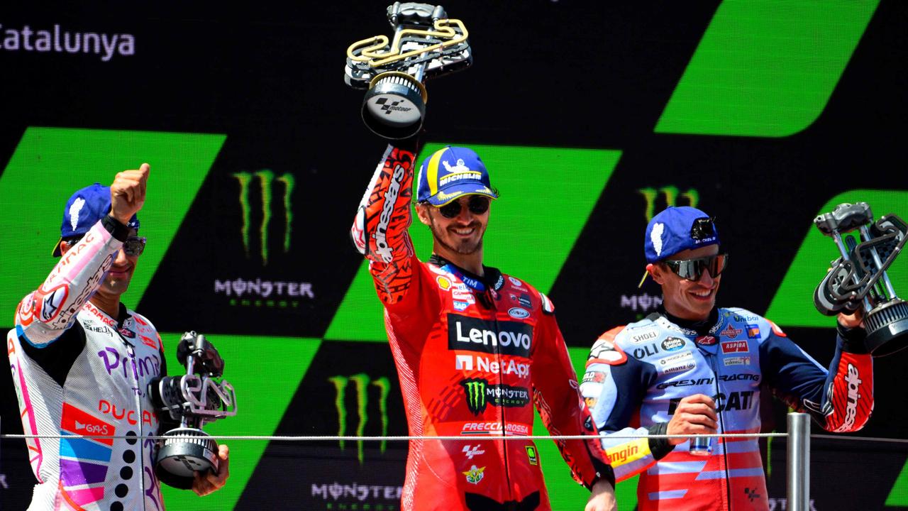 Jorge Martin (left), Francesco Bagnaia (centre) and Marc Marquez (right) made it an all-Ducati podium for the second straight race. (Photo by Josep LAGO/AFP)