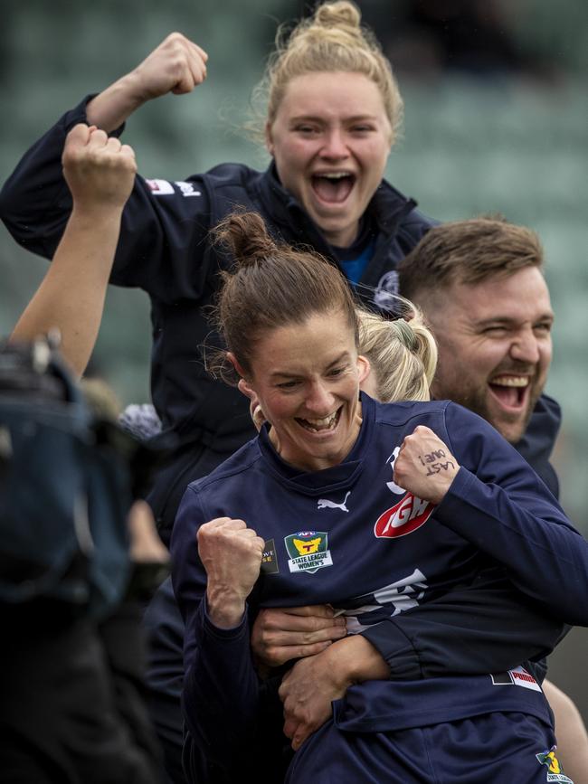 Launceston playing coach Angela Dickson (front) celebrates on the sidelines at the final siren in the TSLW grand final. Picture: LUKE BOWDEN