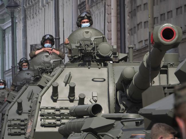 Self-propelled artillery vehicle Msta-S stand prior to a rehearsal for a military parade in St.Petersburg, Russia, Thursday, June 18, 2020. The military parade marking the 75th anniversary of the Nazi defeat was postponed from May 9 because of the coronavirus pandemic and is now set for June 24. (AP Photo/Dmitri Lovetsky)