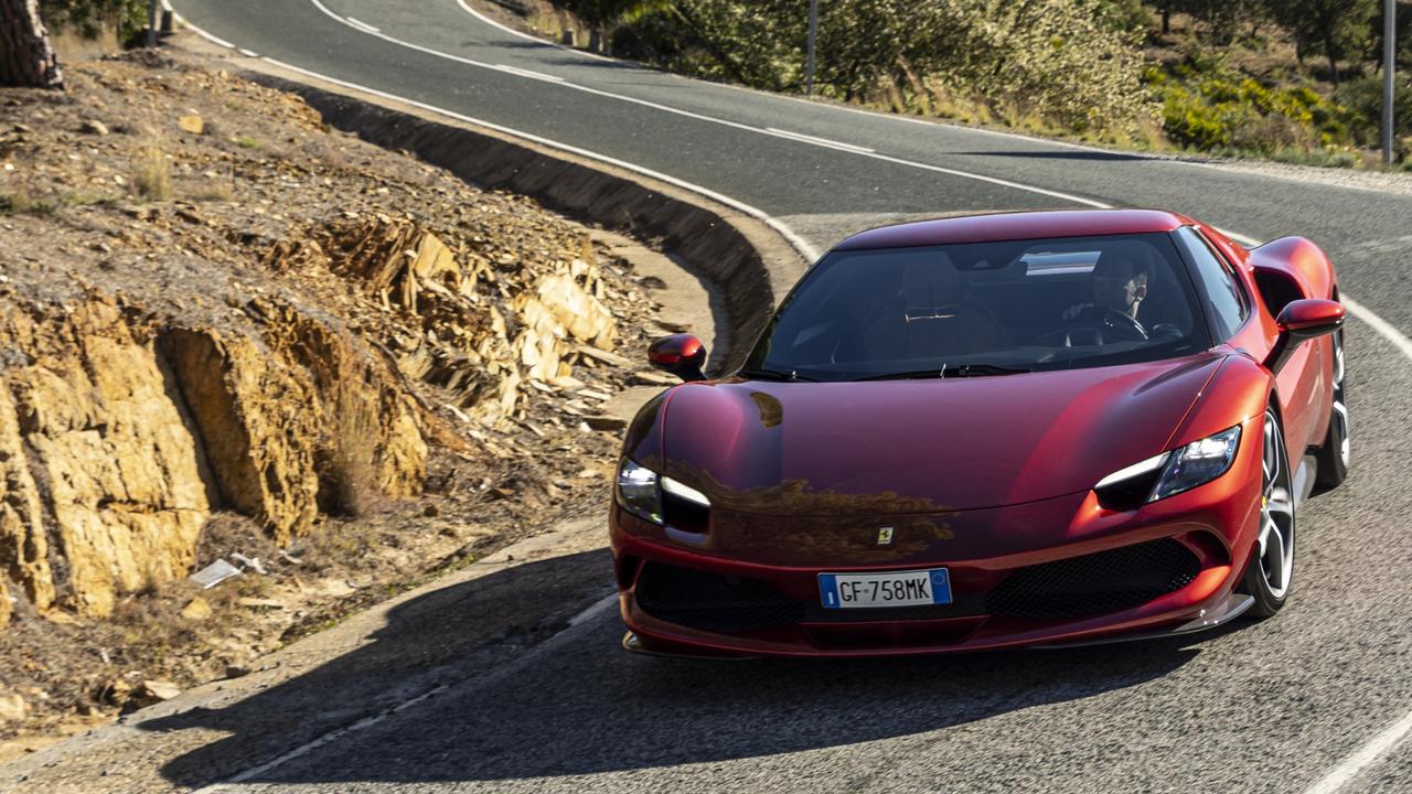 The Ferrari 296 GTB shuts down its engine to save fuel on the road.