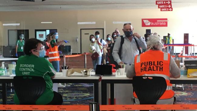 Travellers from South Australia arrive for processing at Alice Springs airport on Wednesday, November 18.