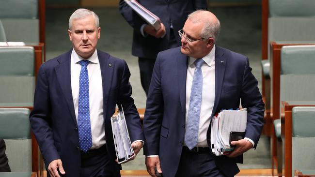 Uneasy bedfellows ... Nationals leader and Deputy PM Michael McCormack enters the House of Representatives alongside Prime Minister Scott Morrison. Picture: Kym Smith