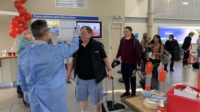 Jetstar passengers having their body temperature checked by NSW Health at Ballina Byron Gateway Airport on July 3.