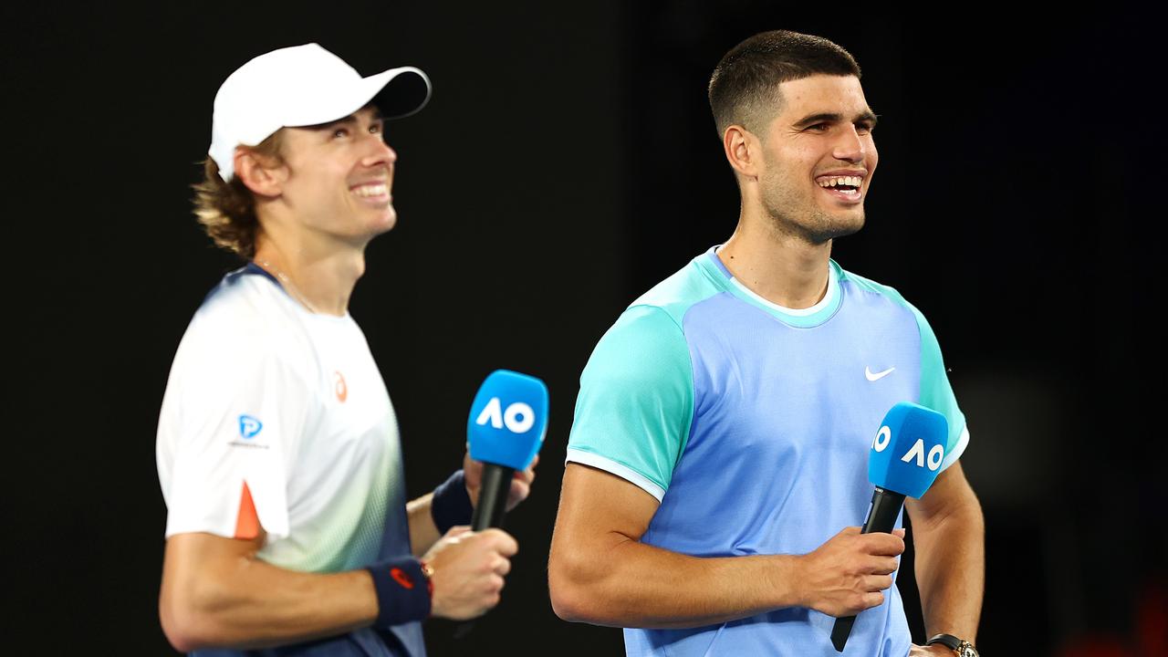 Carlos Alcaraz laughs with Alex de Minaur. Photo by Graham Denholm/Getty Images.