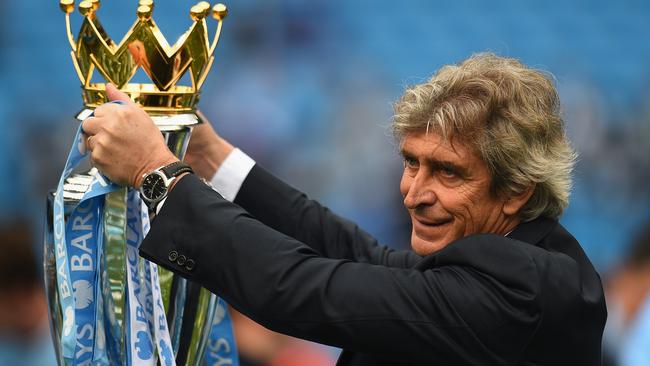 Manchester City Manager Manuel Pellegrini with the Premier League trophy.