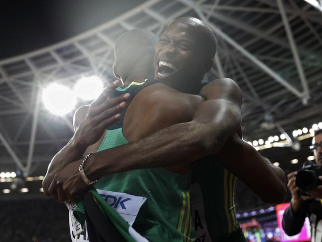 South Africa's gold medal winner Luvo Manyonga, right, is congratulated by his teammate South Africa's Ruswahl Samaai after the men's long jump final during the World Athletics Championships in London Saturday, Aug. 5, 2017. (AP Photo/Matthias Schrader)