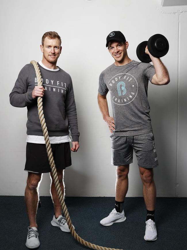 Former Tasmanian and Australian cricket player turned selector George Bailey and current Australian test cricket captain Tim Paine have teamed up with former AFL player Nick Riewoldt in securing the Tasmanian rights to start up Body Fit Training. Picture: Zak Simmonds