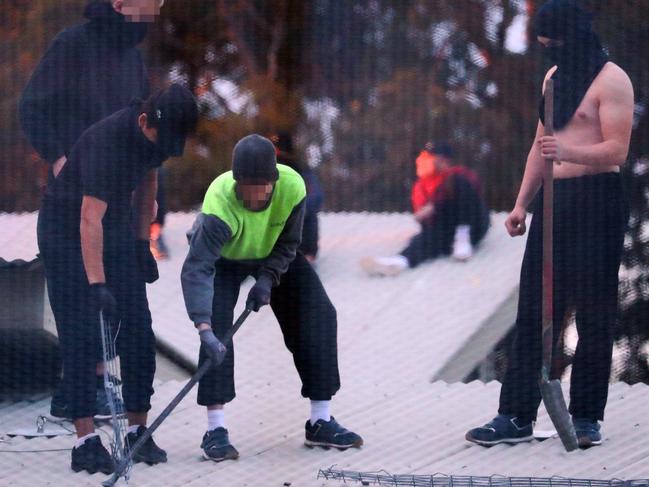 Inmates try to rip panels from the roof at Frank Baxter Correctional Centre. Picture: John Grainger