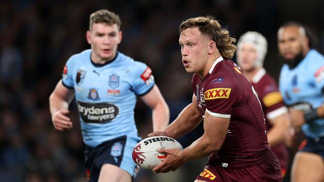 Reuben Cotter of the Maroons runs the ball during game one of the 2022 State of Origin series. Picture: Cameron Spencer/Getty Images