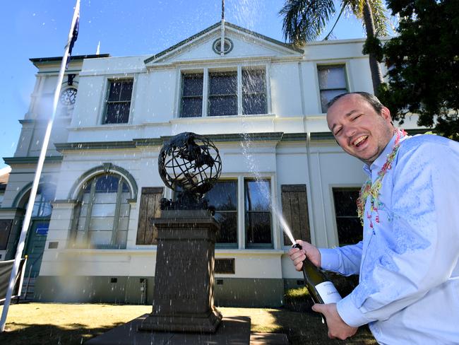 Former Strathfield mayor Andrew Soulos celebrates outside the Strathfield Council chambers in July after the state government decision to call off his council's merger with Burwood and Canada Bay councils. (AAP Image/Joel Carrett)