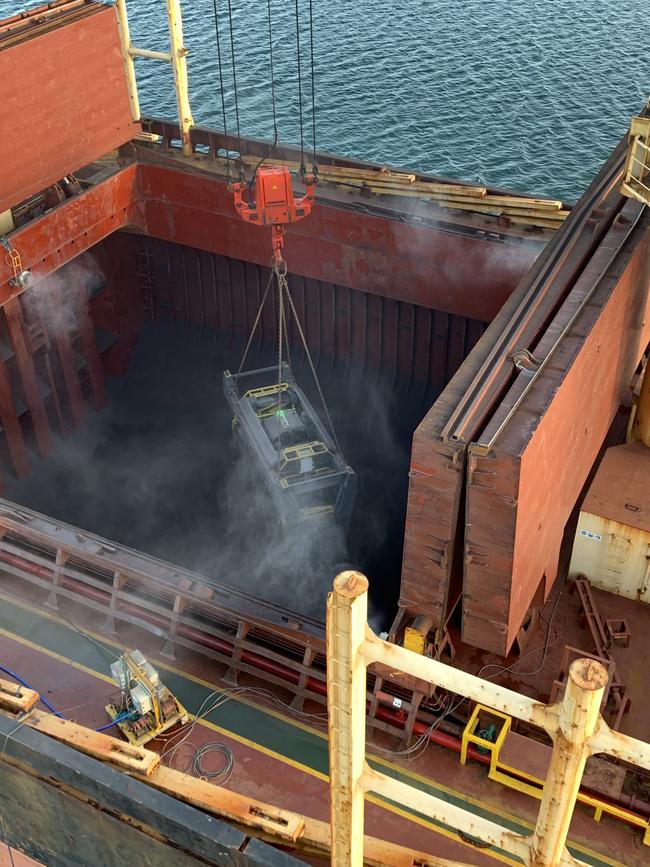 A secure container of copper concentrate from OZ Minerals’ Carrapateena mine is lifted into a vessel at SIMEC Mining’s Whyalla Port.