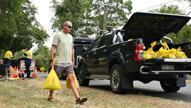 Residents collect sandbags at a Lota depot on Wednesday. Picture: Albert Perez/Getty Images