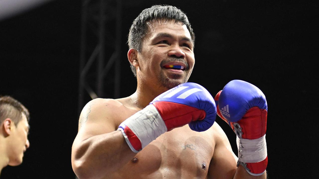 Manny Pacquiao of the Philippines reacts after fighting against DK Yoo of South Korea. Picture: Jung Yeon-je