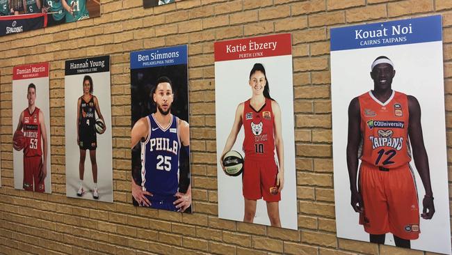 The tribute wall at Newcastle Basketball headquarters. Featured (l-r) Damian Martin, Hannah Young, Ben Simmons, Katie Ebzery and Kouat Noi.