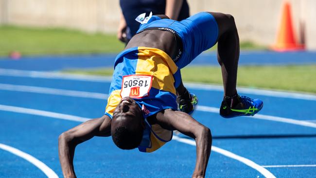 Rashid Kabba from Holroyd Club celebrates winning the U17 110m hurdles.