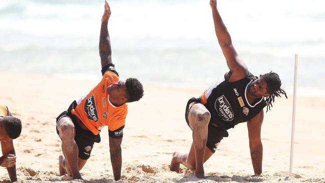 Naiqama and Jamal Indris stretch it out at the beach. Picture. Phil Hillyard