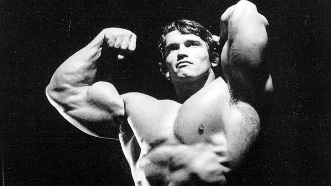  Actor Arnold Schwarzenegger strikes a body building pose in this undated file photo. F/L Muscles that won him Mr Universe - ...