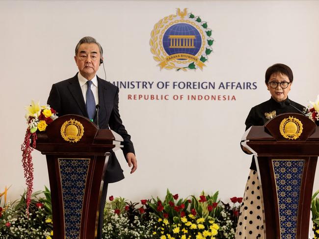 China's Foreign Minister Wang Yi (L) and Indonesia's Foreign Minister Retno Marsudi attend a press conference after their bilateral meeting at the Foreign Ministry office in Jakarta on April 18, 2024. (Photo by Yasuyoshi CHIBA / AFP)