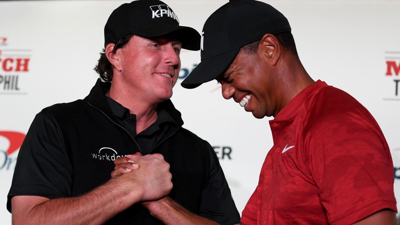 Phil Mickelson and Tiger Woods shake hands. Photo by Harry How/Getty Images for The Match.