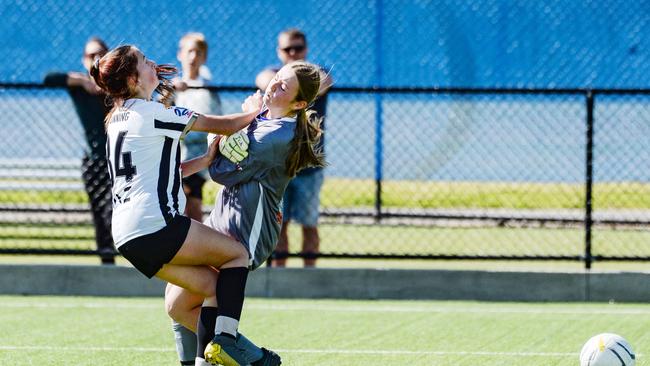 Adelaide City’s Isabelle Dunning puts the ball past Modbury keeper Brianna Hammill to seal the win. Picture: Brenton Edwards