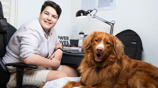 Redkite and Coles Dare to Dream Scholarship recipient and Sam Ottery, 18, with Ace, a pedigree Nova Scotia Duck Toller Retriever. Picture: Renee Nowytarger