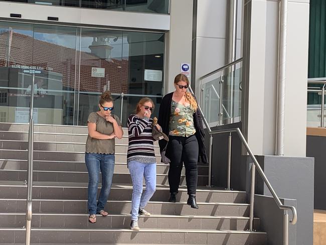 Kel Williams (centre) leaves Rockhampton courthouse