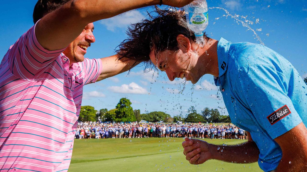 Elvis Smylie (right) celebrates after winning the Australian PGA Championship. Picture: Patrick Hamilton / AFP